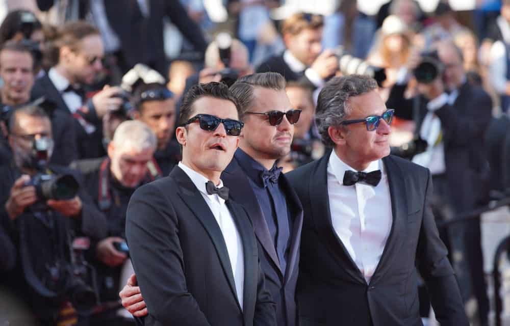 Orlando Bloom and Leonardo Di Caprio attend the screening of "The Traitor" during the 72nd annual Cannes Film Festival on May 23, 2019 in Cannes, France. Bloom looked sexy and stylish with his slick pompadour hairstyle and sunglasses.