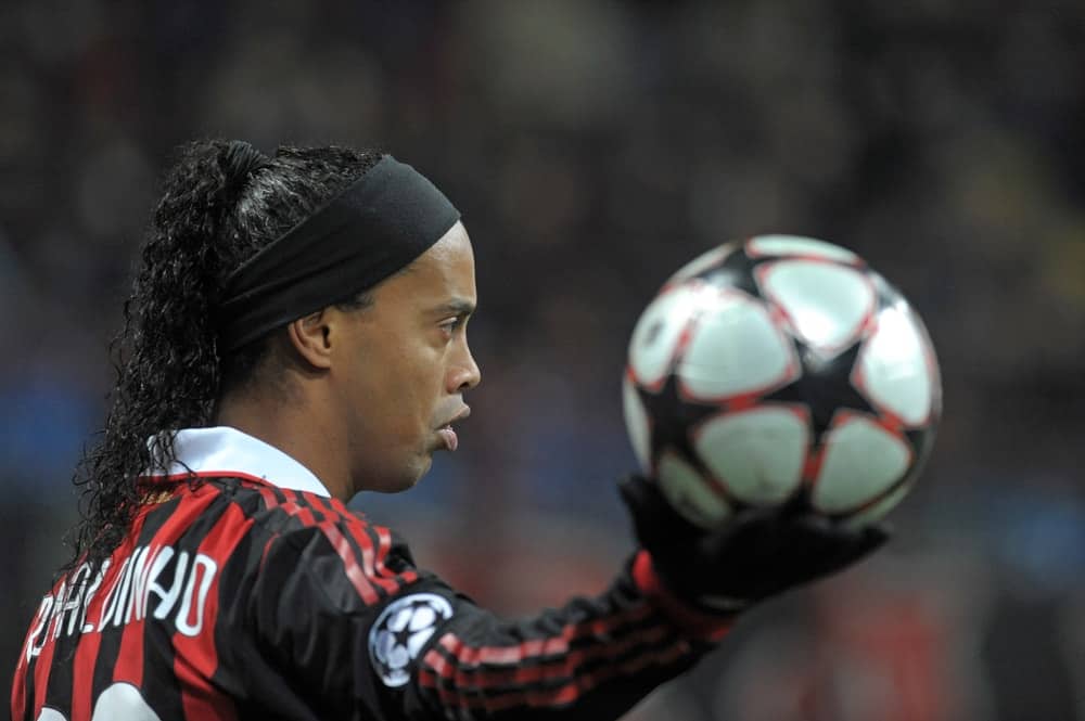 Brazilian player Ronaldinho holds the soccer ball during a UEFA Champions League match, in Milan.