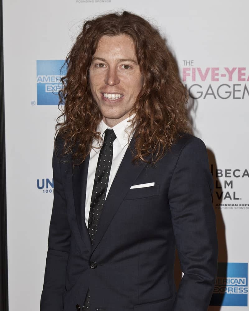Shaun White with his long wavy hair in an elegant suit, spotted in in New York City attending the Five-Year Engagement premier on April 18, 2012.