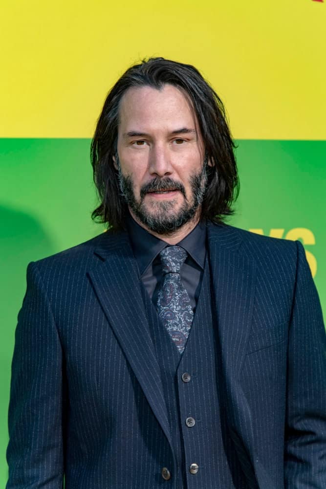 Keanu Reeves has been sporting the shoulder-length hairstyle for men for quite some time. Here he is, wearing his usual look at Netflix's "Always Be My Maybe" World Premiere at Regency Village Theatre, Los Angeles, California.
