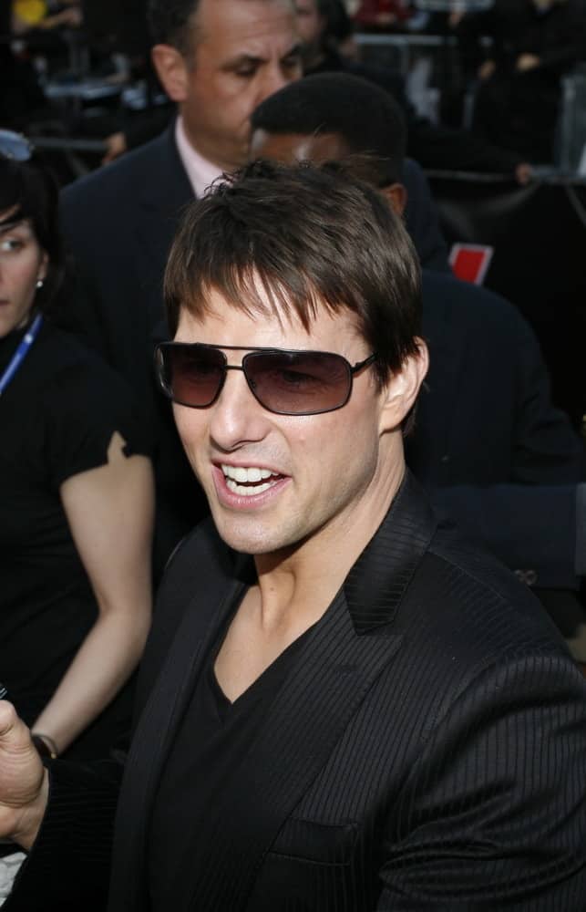 Tom Cruise with fringe bangs and shades.
