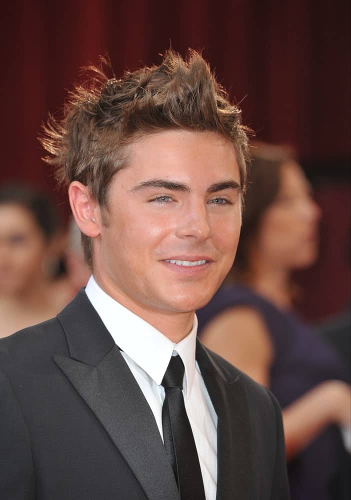 Zac Efron in a black suit, attending the 82nd Annual Academy Awards on March 7, 2010 at the Kodak Theatre, Hollywood.