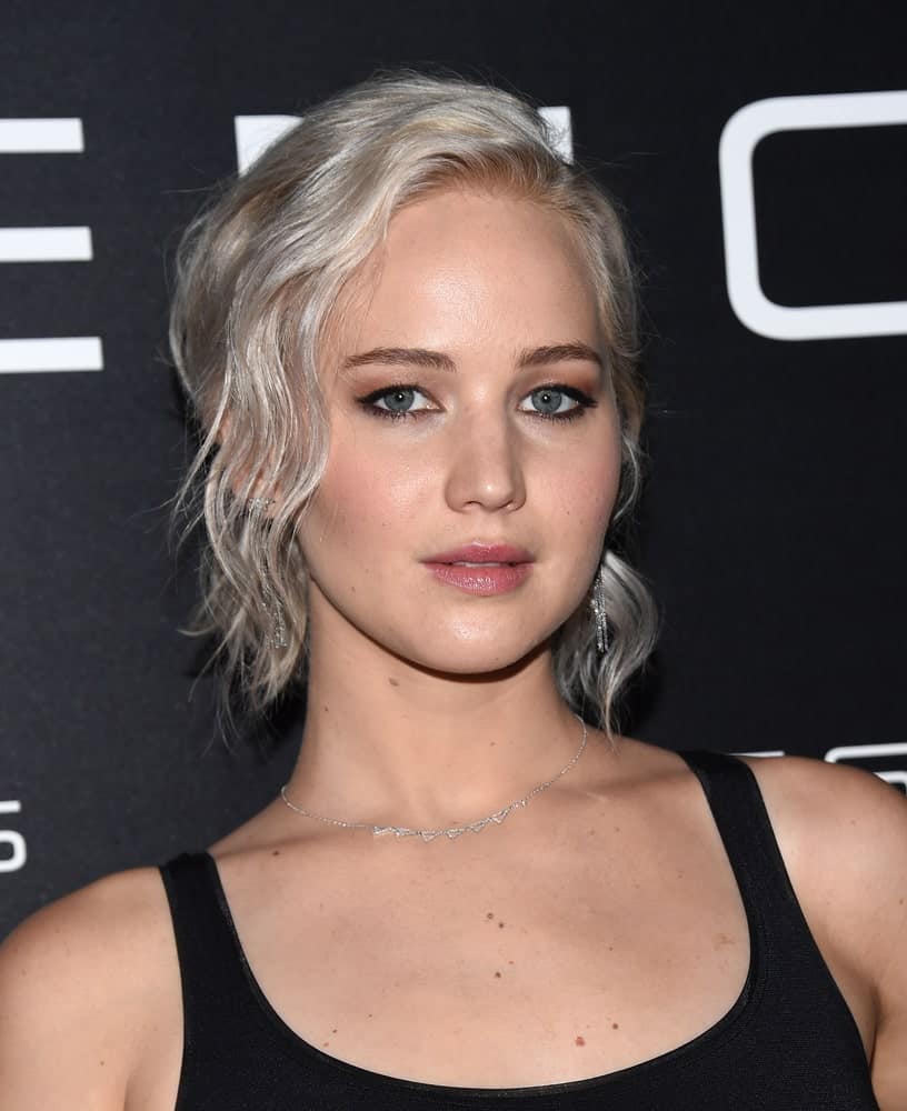 Jennifer Lawrence paired her white-blond wavy ponytail hairstyle with a simple black outfit when she arrived at the Cinema Con 2016: Sony Pictures Presentation on April 12, 2016, in Las Vegas, NV.