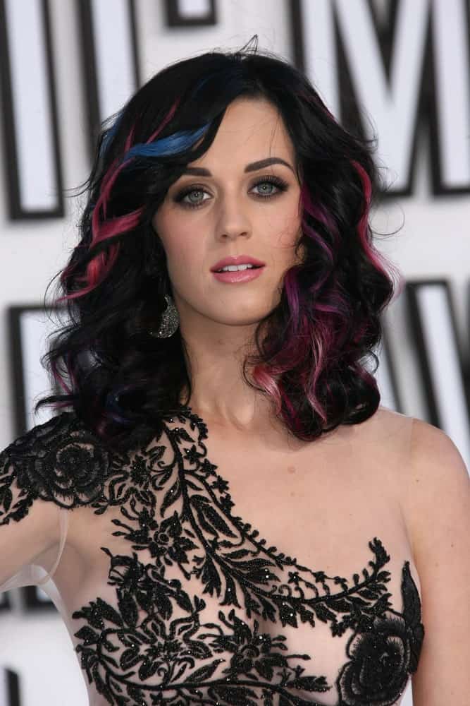 Katy Perry exhibited an edgy look with her dark curls accentuated with blue and pink highlights during the 2010 MTV Video Music Awards at Nokia Theatre L.A. LIVE on August 12, 2010.