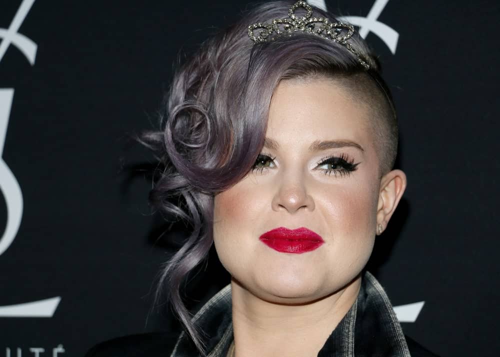 A headshot of the beautiful Kelly Osbourne with her stunning hairstyle and outfit. The photo was taken during the celebration of Zoe Kravitz for her new role with Yves Saint Laurent Beauty on May 18, 2016, held at the Gibson Brands Sunset in West Hollywood, USA.