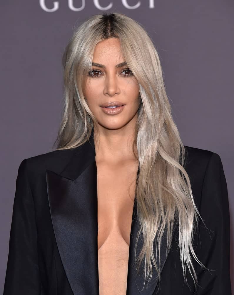 Kim Kardashian contrasts her black suit with silver-blonde loose waves during the 2017 LACMA Art + Film Gala on November 04, 2017, in Los Angeles, CA.