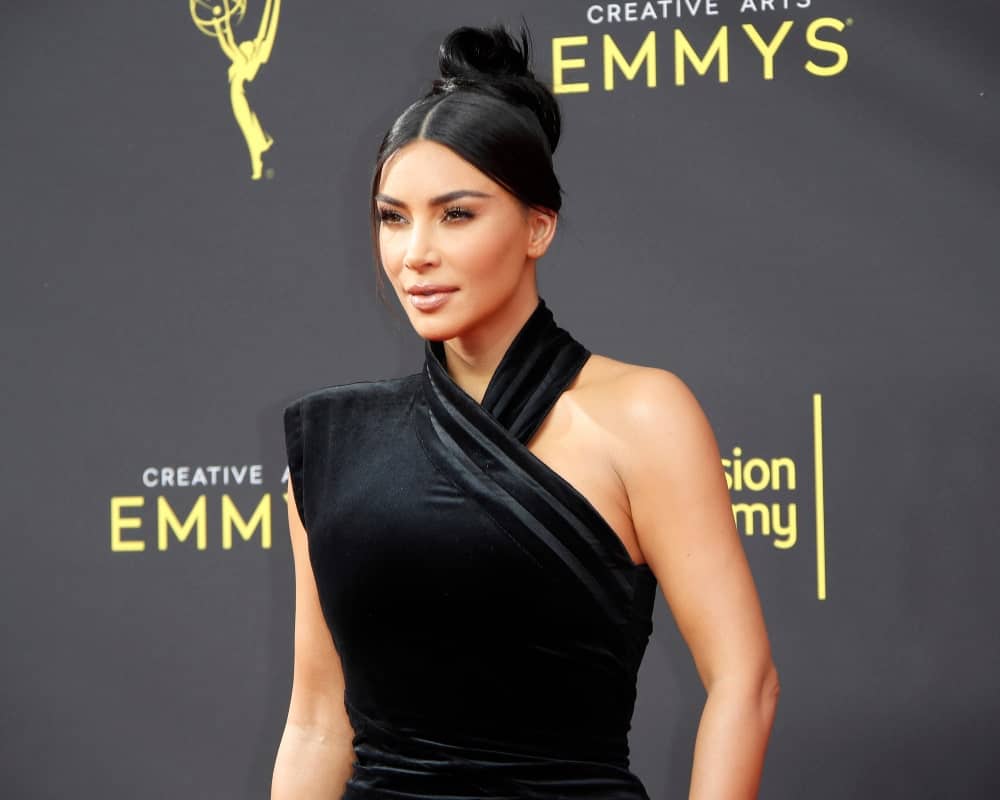 Kim Kardashian sported a slicked center-parted upstyle during the 2019 Primetime Emmy Creative Arts Awards at the Microsoft Theater on September 14, 2019.