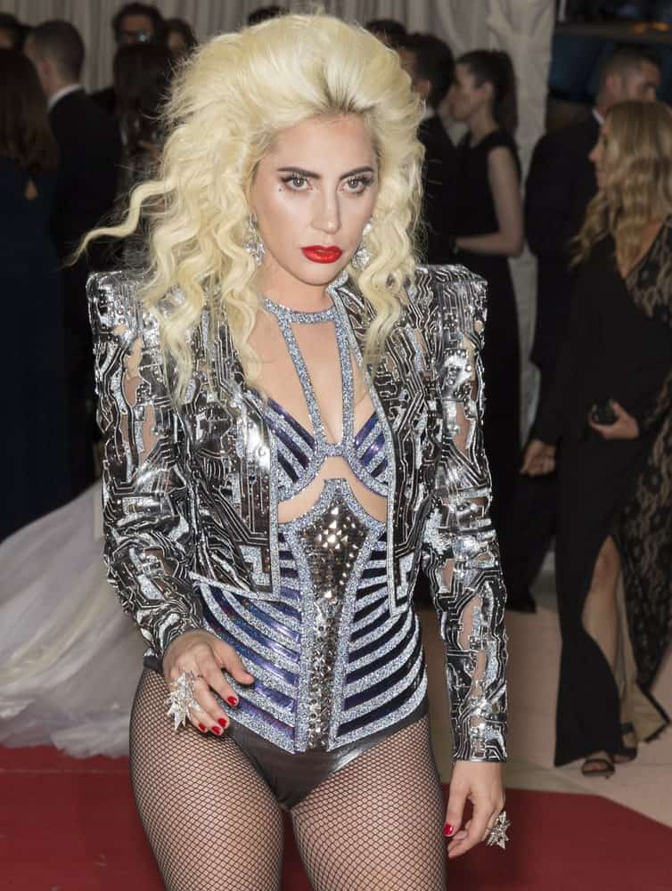 On May 2, 2016, Lady Gaga attended the Manus x Machina Fashion in an Age of Technology Costume Institute Gala at the Metropolitan Museum of Art. She wore a shiny and silvery fashionable outfit with circuitry details and a large tousled blond hair with a slight beehive look.