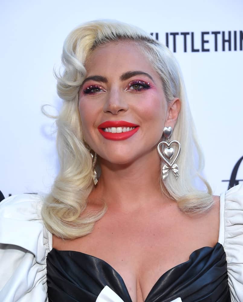 Lady Gaga looked quite classy in her black and white leather dress that she paired with a white-blond hairstyle that has side-swept waves when she arrived for the The Daily Front Row 5th Annual Fashion LA Awards on March 17, 2019, in Beverly Hills, CA.