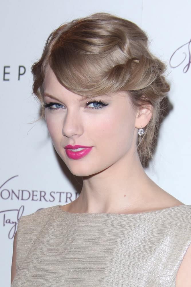 Taylor Swift made an appearance at the “Wonderstruck” Fragrance Launch at Sephora Americana on October 18, 2011 exhibiting a curly updo with twisted side bangs.