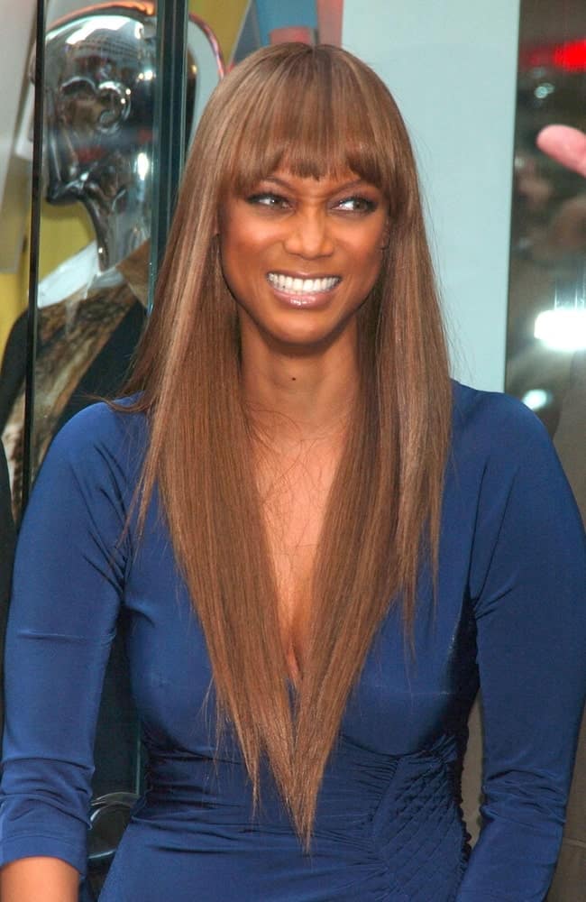 Tyra Banks attended the Just Cavalli Flagship Store Grand Opening Party in New York on September 07, 2007. She wore a classy blue dress with her silky smooth straight hairstyle with blunt bangs.