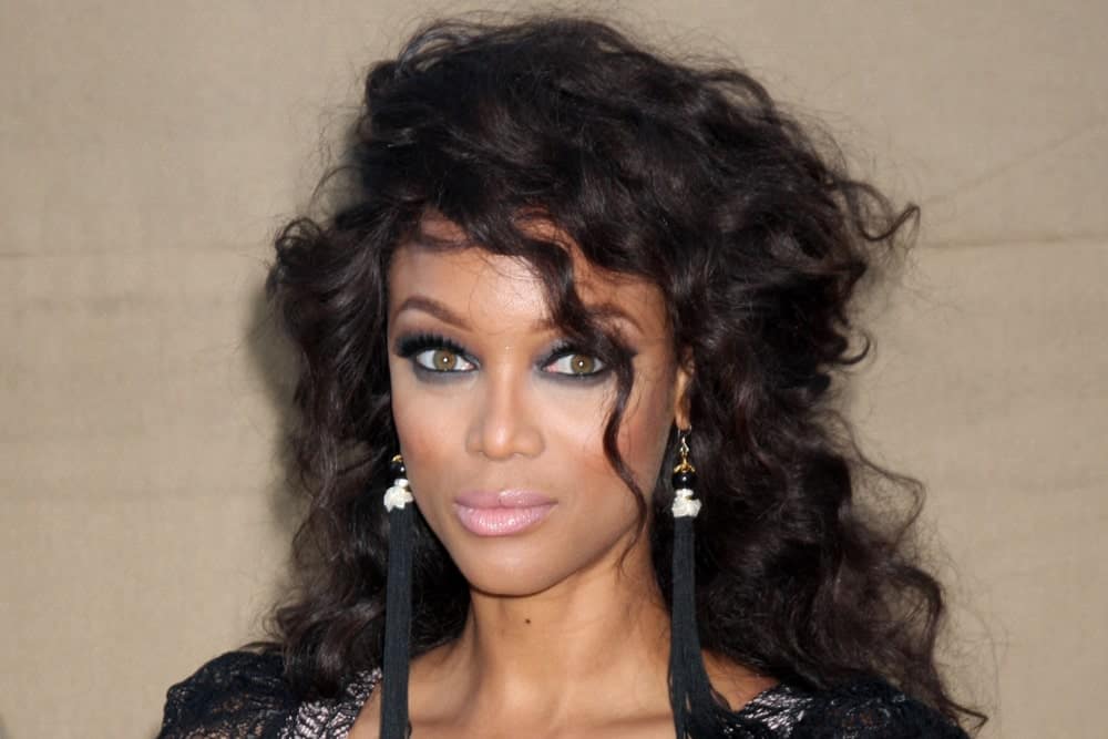 Tyra Banks was quite stylish with her black dress that she paired with her long and tousled raven curly hair with a slight half-up hairstyle when she arrived at the 2013 CBS TCA Summer Party at the private location on July 29, 2013 in Beverly Hills, CA.
