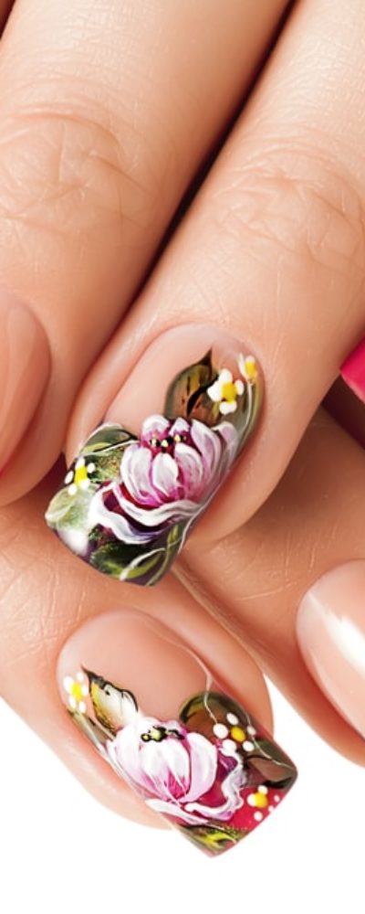 Close-up of a woman's hand with floral nail art manicure.