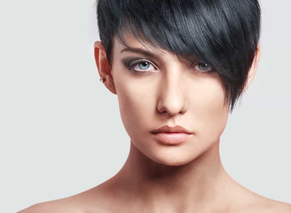 A close look at a woman with A-line pixie hairstyle.