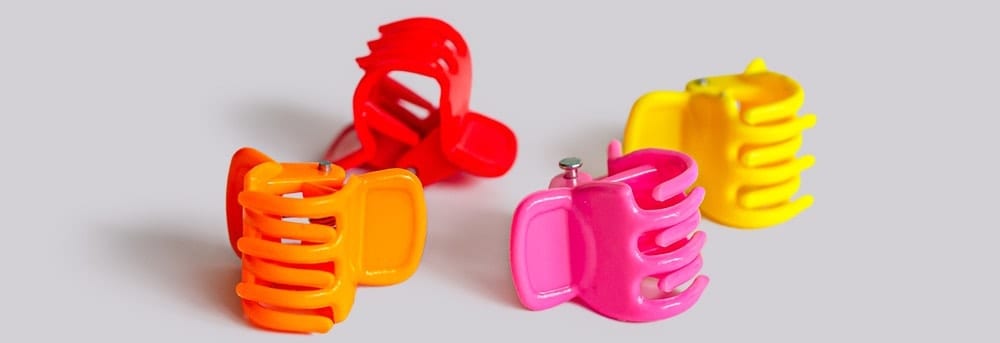 A look at a set of colorful plastic round clips.