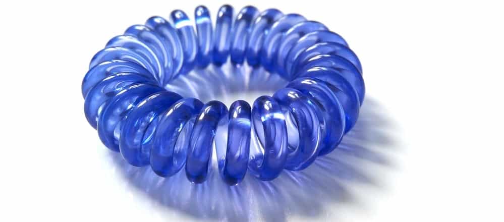 A blue plastic spiral hair tie.