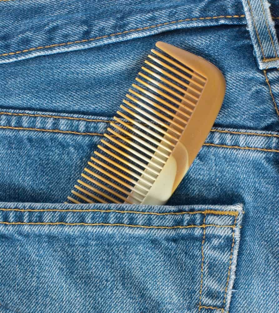 A look at a brown pocket comb in a jeans pocket.