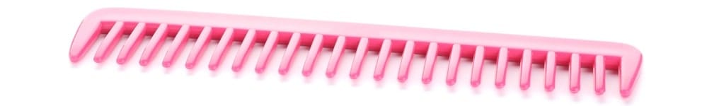 A close look at a pink plastic rake comb.