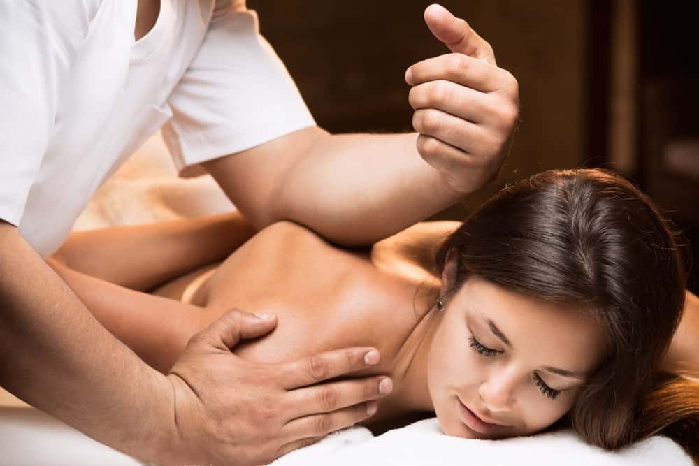 A woman enjoying her deep tissue massage.