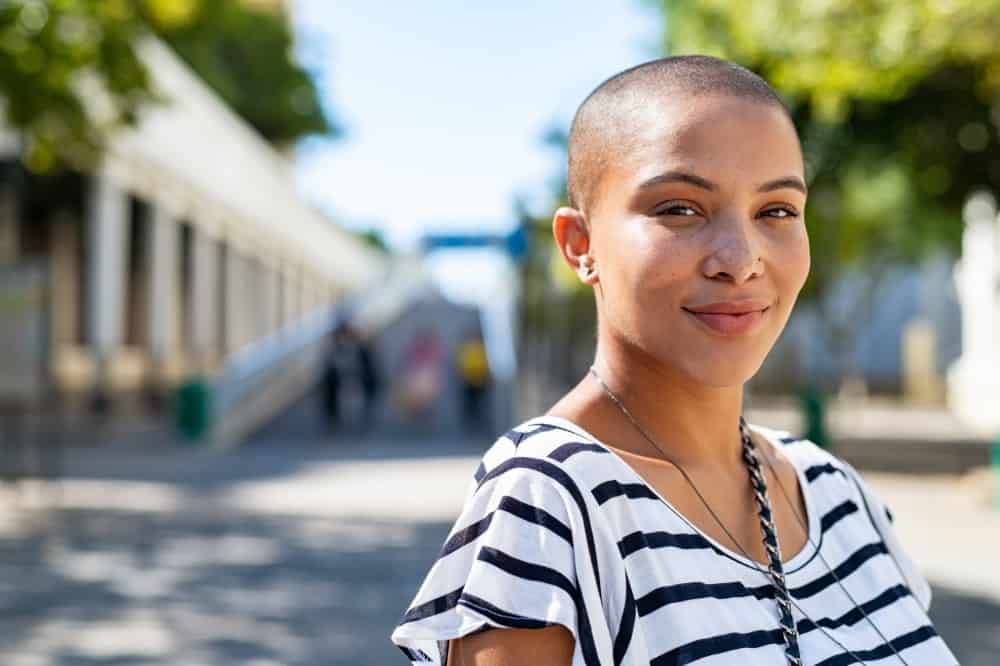 An attractive woman with a shaved head.
