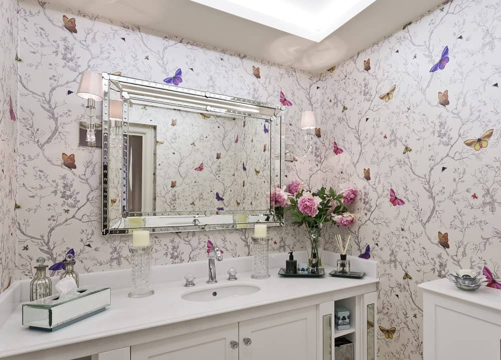 Bathroom with butterfly wallpaper.